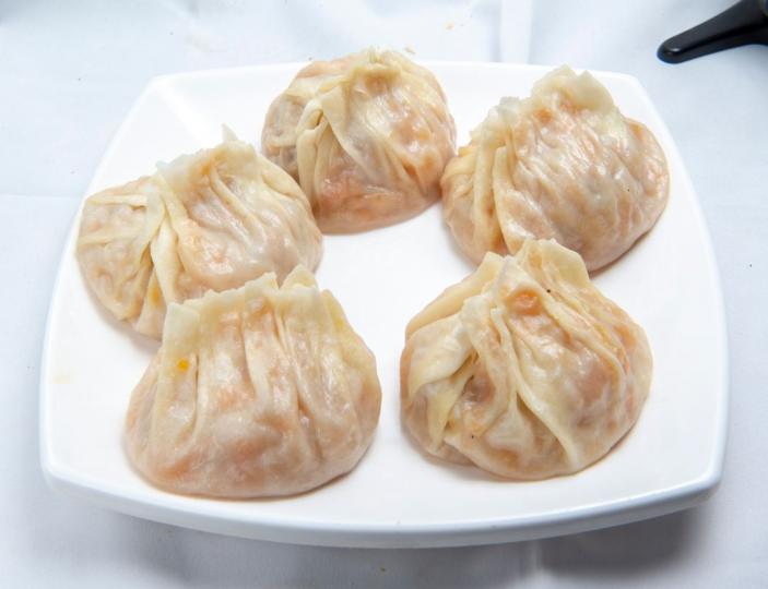 每當葫蘆上市，維吾爾族便開始做這種包子，秋季時還會儲存葫蘆，以備冬季食用。
麥翔雲／攝...