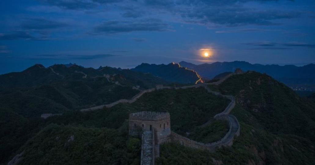 Photos show the scenery of a full moon rising over a section of the Great Wall in Jinshanling, north...