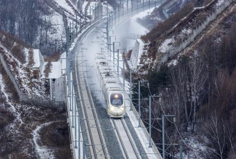 Bullet trains zoom through the fluttering snow and icy wind in northeast China's Jilin Province.... Bullet trains zoom through the fluttering snow and icy wind in northeast China's Jilin Province....