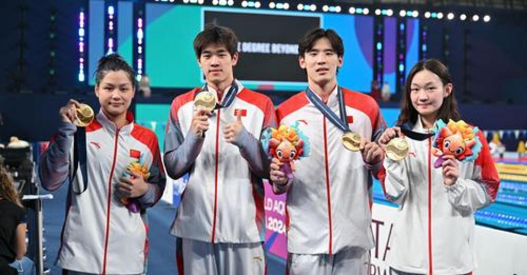 China broke its own Asian record to claim the mixed 4x100m freestyle relay world title...