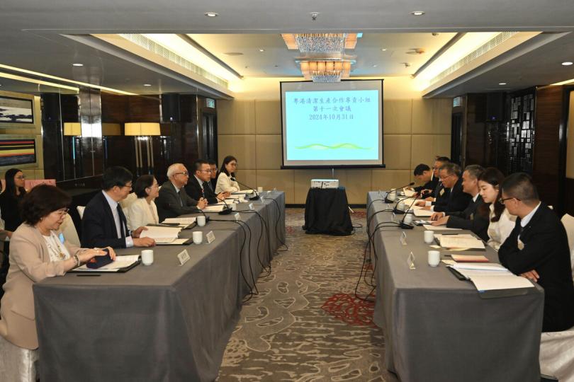 改善環境:  謝展寰（左四）和涂高坤（右四）共同主持粵港清潔生產合作專責小組第11次會議。