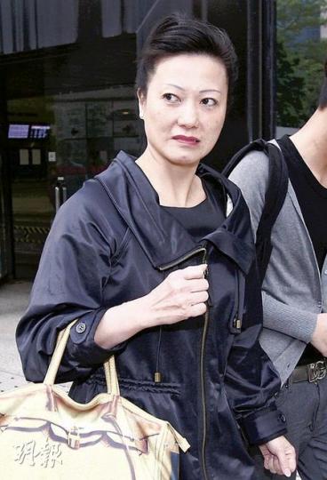 老海員陳濤的侄媳李妙芳（圖）昨日被質疑，他們一家於2005年底早已知悉被告是陳的養子，故即使被告一直佔用陳的兩物業，他們亦沒有報警。（李紹昌攝）