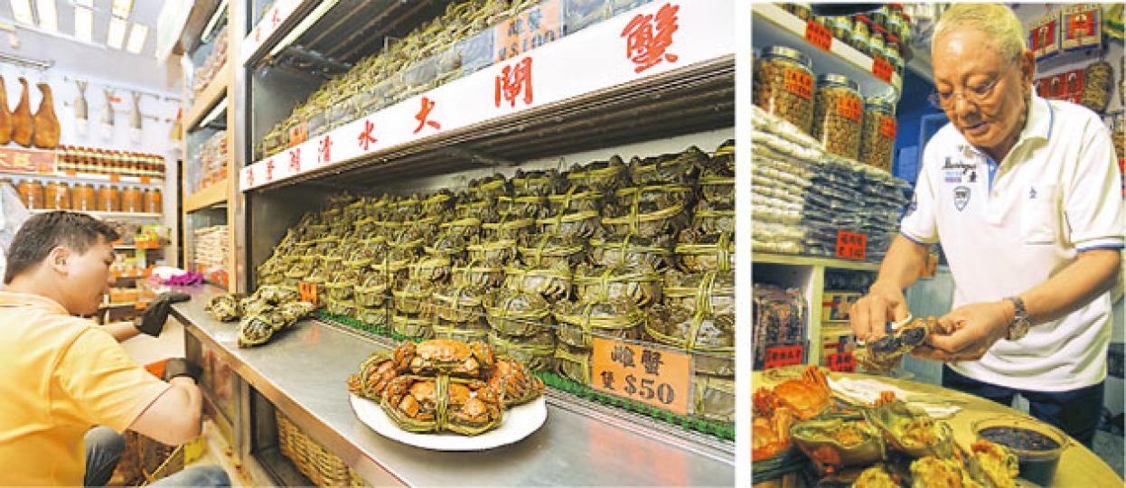 老三陽老闆祁廣楠（右圖）指出，今年江蘇一帶的天氣適合大閘蟹生長，加上內地反貪腐減少送禮，蟹價不似往年般被搶高，令售價較去年回落，以5至6両的中蟹計每隻售120至160元、約4両的細蟹則售40至60元。他表示，今年的大閘蟹質量較佳，蟹膏不見「水汪汪」而是「又黃又實」，價格亦較去年下降約一成半。（鄧宗弘攝、錢瑋琪攝）