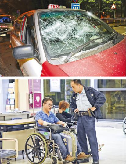 案件中涉事的士遭兩車截停,被人用鐵棍把擋風玻璃及兩邊車窗擊碎(上圖),司機亦遭打傷需送院治理(下圖)。(蔡方山攝) 案件中涉事的士遭兩車截停,被人用鐵棍把擋風玻璃及兩邊車窗擊碎(上圖),司機亦遭打傷需送院治理(下圖)。(蔡方山攝)