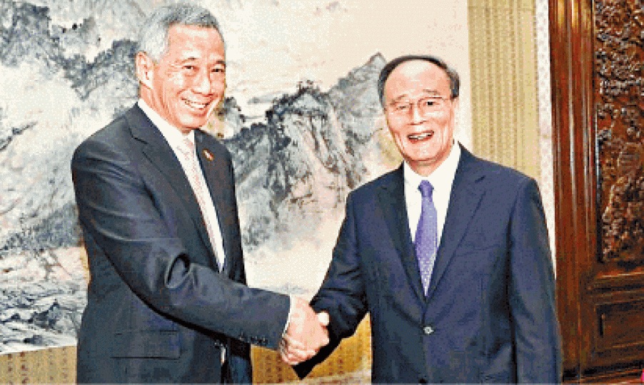 ■王岐山（右）對李顯龍點名見面感「很意外」。
