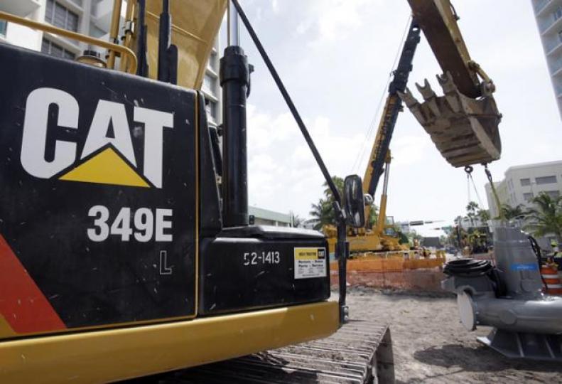 FILE- In this Wednesday, Sept.17,2014, file photo, a Caterpillar349E Hydraulic Excavator operates on a construction site in Miami Beach, Fla. Caterpillar reports financial results Tuesday, Oct.25,2016.(AP Photo/Wilfredo Lee, File)
FILE- In this Wednesday, Sept.17,2014, file photo, a Caterpillar349E Hydraulic Excavator operates on a construction site in Miami Beach, Fla. Caterpillar reports financial results Tuesday, Oct.25,2016.(AP Photo/Wilfredo Lee, File)
