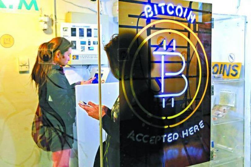 ■比特幣1月份期貨昨下跌,但現貨則上升。資料圖片 ■比特幣1月份期貨昨下跌,但現貨則上升。資料圖片