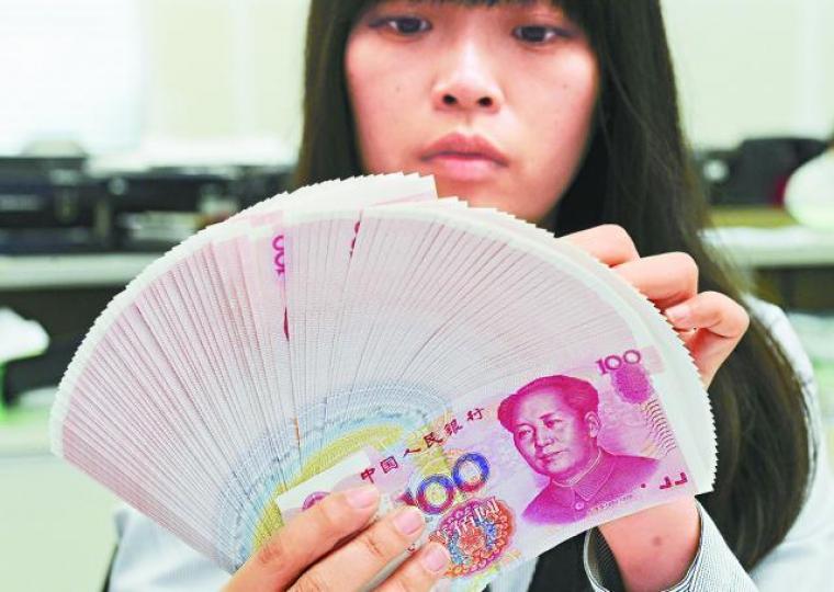 ■人民幣今年止跌,券商預期明年匯價趨穩。資料圖片 ■人民幣今年止跌,券商預期明年匯價趨穩。資料圖片
