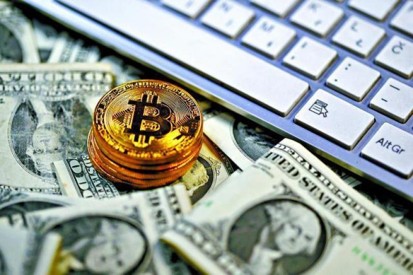■比特幣現貨昨一度彈11%,重上15,000美元。資料圖片 ■比特幣現貨昨一度彈11%,重上15,000美元。資料圖片
