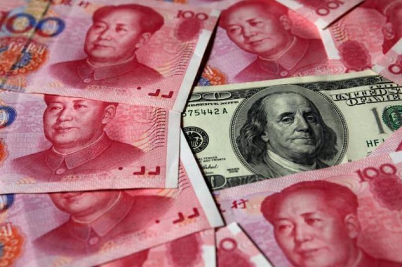 ■預期美滙在年內將持續下跌,年中前,人民幣或會升近6.30的滙改後高位。資料圖片 ■預期美滙在年內將持續下跌,年中前,人民幣或會升近6.30的滙改後高位。資料圖片