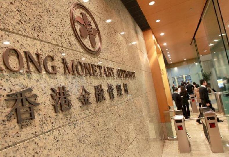 ■預期金管局將持續於公開市場沽美元買港元,以應付套利者的沽盤。資料圖片 ■預期金管局將持續於公開市場沽美元買港元,以應付套利者的沽盤。資料圖片