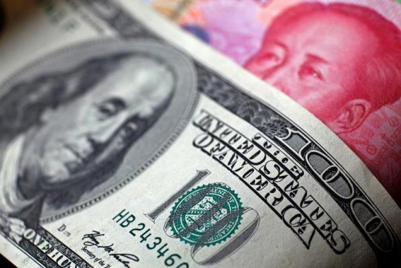 ■若中國貿易順差減一半,人民幣貶值壓力將大增。資料圖片 ■若中國貿易順差減一半,人民幣貶值壓力將大增。資料圖片