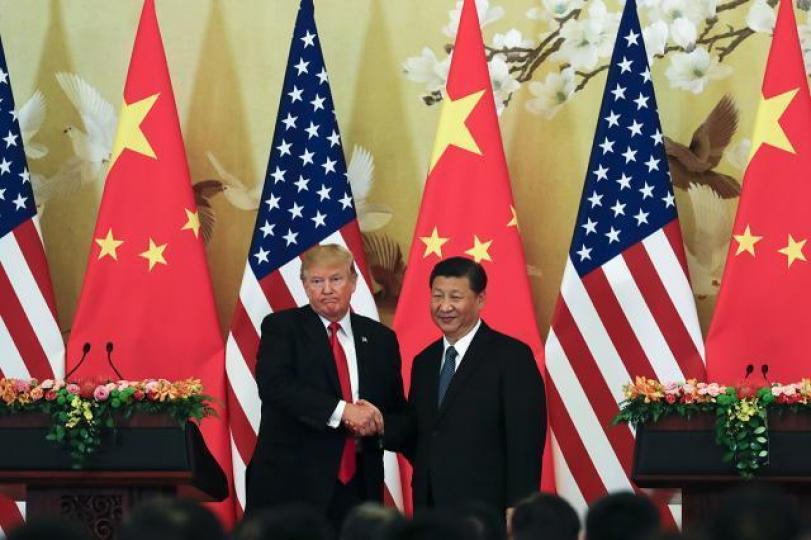 ■中美貿易談判繼續是主軸，特朗普（左）形容習近平是「世界級的撲克牌高手」。資料圖片