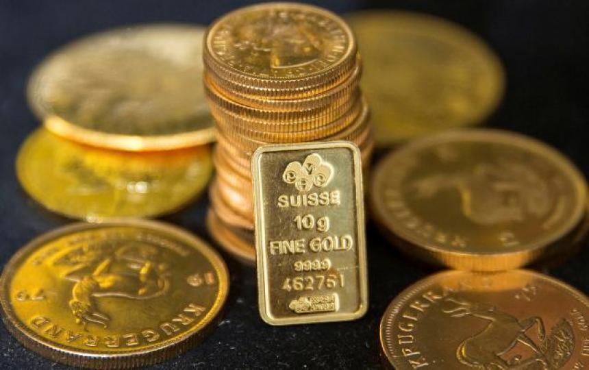 ■現貨金價上周曾跌至16個月低位,收報每盎斯1,209.2美元,是連續四周向下。 資料圖片 ■現貨金價上周曾跌至16個月低位,收報每盎斯1,209.2美元,是連續四周向下。 資料圖片