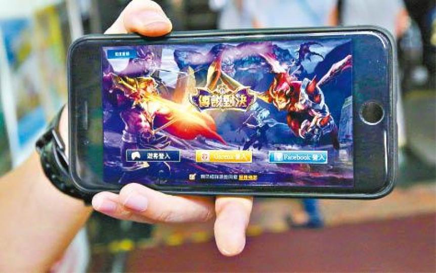 手機遊戲《王者榮耀》曾遭官媒狠批。 手機遊戲《王者榮耀》曾遭官媒狠批。