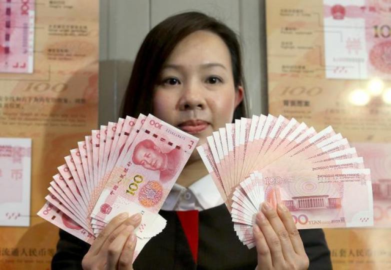 人民幣在岸價昨造好,曾升穿每美元兌6.7關。資料圖片 人民幣在岸價昨造好,曾升穿每美元兌6.7關。資料圖片